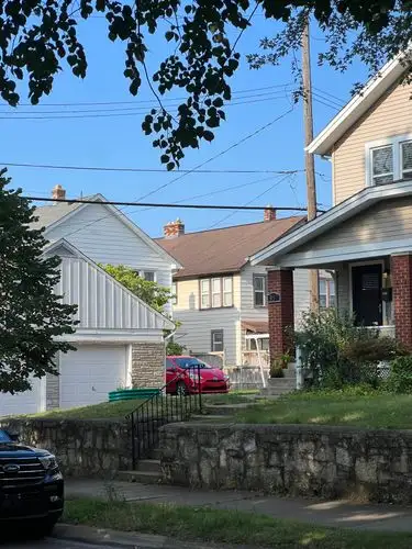 Neighborhood charm under the summer sky.
